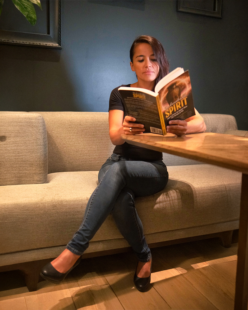 Woman reading Unbreakable Spirit